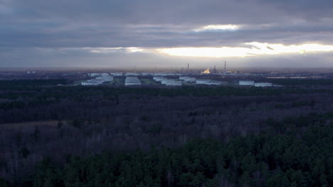 Aerial-flight-towards-Pern-Factory-in-Gdansk-with-liquids-storage-terminal-during-cloudy-day