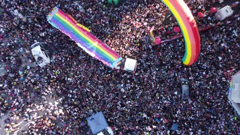 Rainbow-colored-flags-during-LGBT-Pride-Parade-in-Buenos-Aires---Aerial-top-down