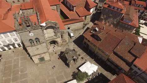 Aerial-view-Oliveira-square-landmark-with-Church,-Guimaraes