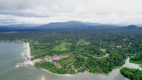 Aerial-Drone-Footage-of-Forest,-Mountains,-Coast-and-residential-fishing-village