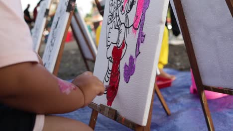 Little-Child-Painting-With-Brush-in-public-area