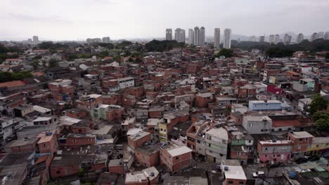 Aerial-view-overlooking-a-slum-neighborhood,-in-Sao-Paulo,-Brazil---circling,-drone-shot