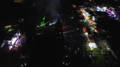 drone-flying-over-people-at-pop-musician-concert,-performance