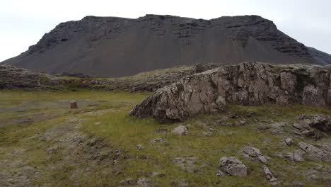 Large-cliff-with-empty-road-in-Iceland's-nature