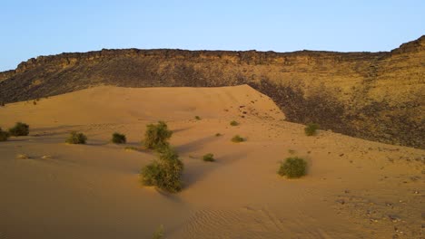 Sand-Dune-Cliffs-in-Sahara-Desert,-Mauritania,-Africa---Aerial-Establishing