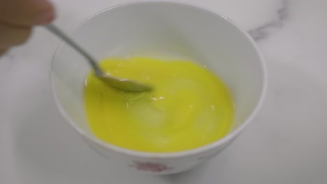 Whisking-Egg-in-a-small-bowl