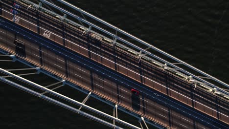Aerial-view-over-cars-on-the-Verrazzano-Narrows-Bridge,-in-NY,-USA---cenital,-drone-shot