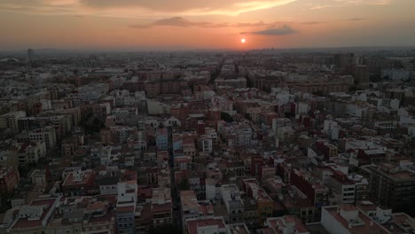 Wide-Aerial-shot-of-residential-area-El-Cabanyal-in-Valencia,-Spain,-Sunset