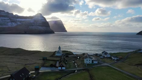Epic-aerial-shot-of-an-old-town-in-the-Faroe-Islands-during-sunset