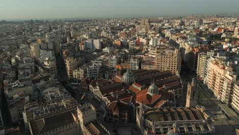 Wide-Aerial-morning-view-of-Valencia-central-market-landmark-and-old-town-in-Spain