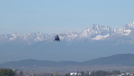 Civilian-Mi-8-helicopter-approaching-landing-zone-in-Tatra-Mountains,-Slovakia