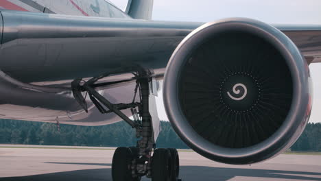Jet-engine-turbine-spinning-slowly-on-tarmac