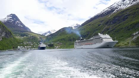 View-of-cruise-ship-from-a-travelling-boat-in-Geiranger-Fjord