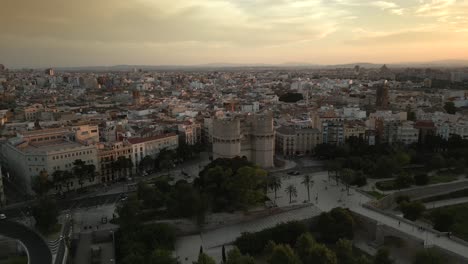 Aerial-view-of-historical-landmark-Towers-serranos,-Spain,-Valencia,-Summer-sunset