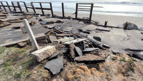 Coastal-sidewalk-pavement-destroyed-by-storm-caused-by-climate-change