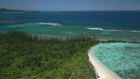 Ilot-Moro-a-small-island-is-part-of-the-archipelago-of-the-Isle-of-Pines-in-New-Caledonia---aerial-tilt-down-flyover