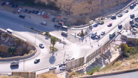 Aerial-view-of-Al-Karak-city-with-vehicles-and-traffic-from-Kerak-Medieval-Castle-in-Jordan,-Middle-East