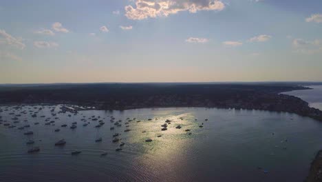 Mass-ocean-Bay-with-boats,-and-sailboats---drone-video