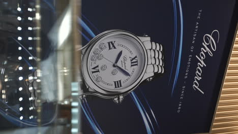 VERTICAL,-Elegant-Chopard-watch-advertisement-inside-expensive-Barcelona-jewellery-store