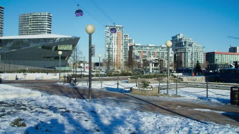 Static-shot-of-cable-cars-at-London-Royal-Docks-on-a-snowy-winter-morning