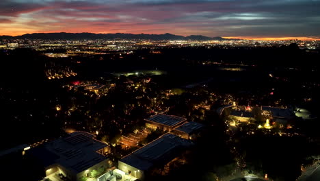 Aerial-over-Las-Noches-De-Las-Luminarias-festive-event-in-Phoenix,-vivid-sunset