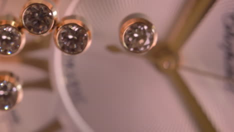 Luxury-Chopard-watch-bokeh-macro-face-with-expensive-sparkling-diamonds-movement-across-the-dial