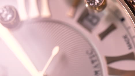 Luxury-Chopard-watch-face-bokeh-macro-with-expensive-sparkling-diamonds-movement-across-the-dial