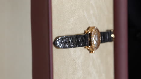 VERTICAL-luxury-Chopard-swiss-watch-displayed-on-jewellery-store-velvet-tray