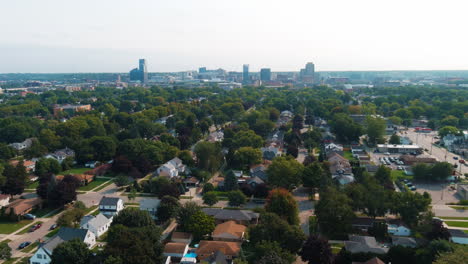 Grand-Rapids-Michigan-City-Skyline-Aerial-Flying-Over-Trees-Houses