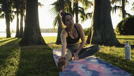 Beautiful-young-adult-waking-up-for-an-early-morning-outdoor-yoga-and-stretching-session