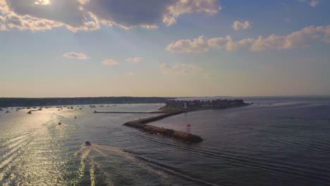 Following-a-boat-with-a-drone-on-the-ocean,-timelapse