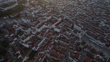 Topdown-view-towards-Nazare-downtown-during-dusk-lights,-Portugal