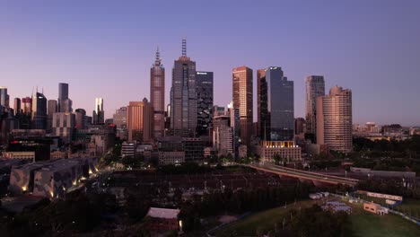 Financial-district-Melbourne-city-block-purple-sunset-glow,-Australia