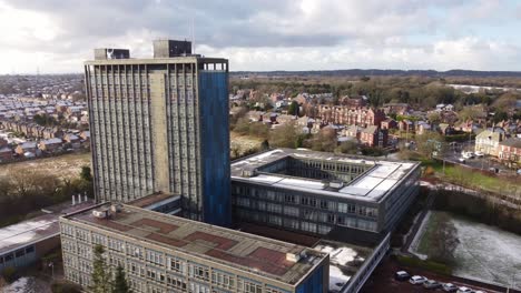 Aerial-view-Pilkington's-glass-head-office-townscape,-a-corporate-blue-high-rise-with-shared-office-space