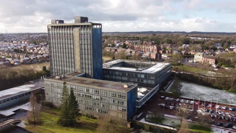 Aerial-view-Pilkington's-glass-head-office,-townscape-with-blue-high-rise-with-shared-office-space