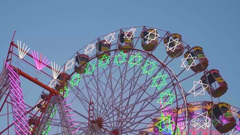Slowmotion-shot-of-a-Ferris-wheel-in-a-carnival-fest-at-Gwalior-Trade-fair-,-India