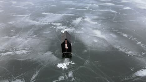 Winter-Wonderland:-An-Aerial-Shot-of-Ice-Fishing-on-Frozen-Lac-la-Hache-Lake-in-British-Columbia,-Canada