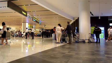 Singapore-Changi-Airport-with-people-traveling,-waiting,-and-standing-by