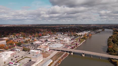 Saginaw-city-center-and-riverside,-Michigan,-USA-in-fall,-drone-view
