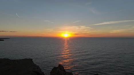 Sunset-over-the-Mediterranian-sea-from-Punta-Nati-Lighthouse-in-Menorca