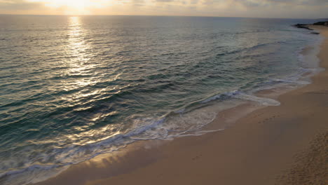 Ocean-waves-gently-splashing-on-sandy-beach