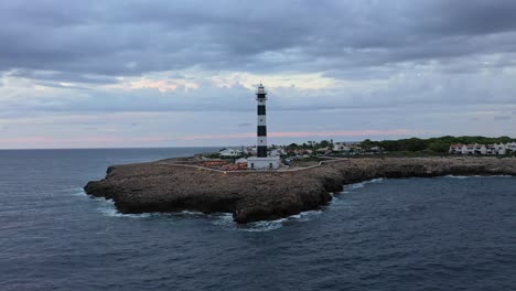 Aerial-orbit-of-Artutx-Lighthouse-in-Menorca-Spain