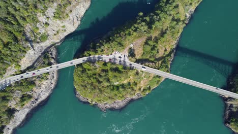 Ascending-top-down-birds-eye-view-drone-shot-of-deception-pass-bridges-in-anacortes-washington-WA-USA-on-a-sunny-spring-day