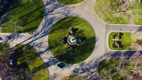 Symmetrical-Aerial-View-of-Roundabout-with-Cars-Driving-around-the-Park