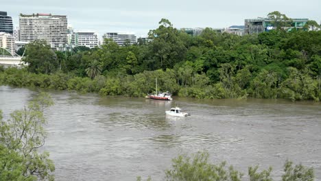 A-rescue-boat-struggling-to-move-during-Brisbane's-floods-in-February-2022