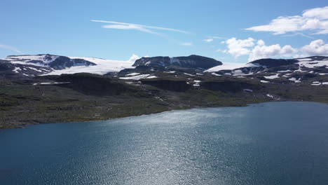 Drone-shot-of-mountain-lake-in-Finse,-Norway