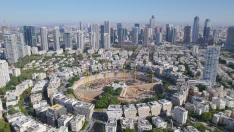 High-altitude-parallax-view-of-a-big-city-square-project-construction---skyscrapers-in-the-background