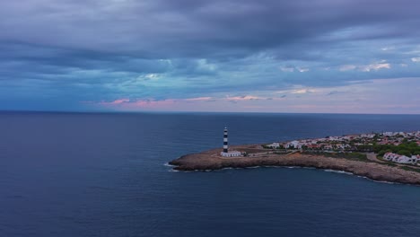 High-aerial-approach-towards-Artrutx-lighthouse-in-Menorca-Spain