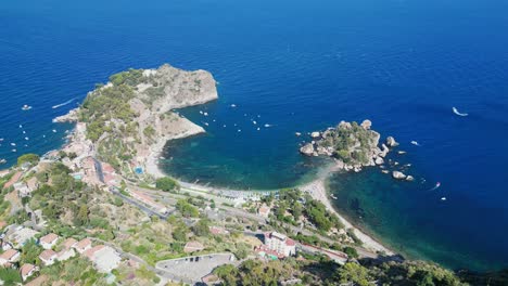 Isola-Bella-Island-and-beach-in-Taormina,-Messina,-Sicily,-Italy---Aerial-4k-Tilting-Down