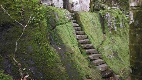 Ancient-Ruins-Stone-Stairs-and-Mystical-Gate-at-Goa-Garba-Temple,-Bali,-Indonesia,-Archaeological-Site-in-Tampaksiring-Gianyar-from-12th-Century